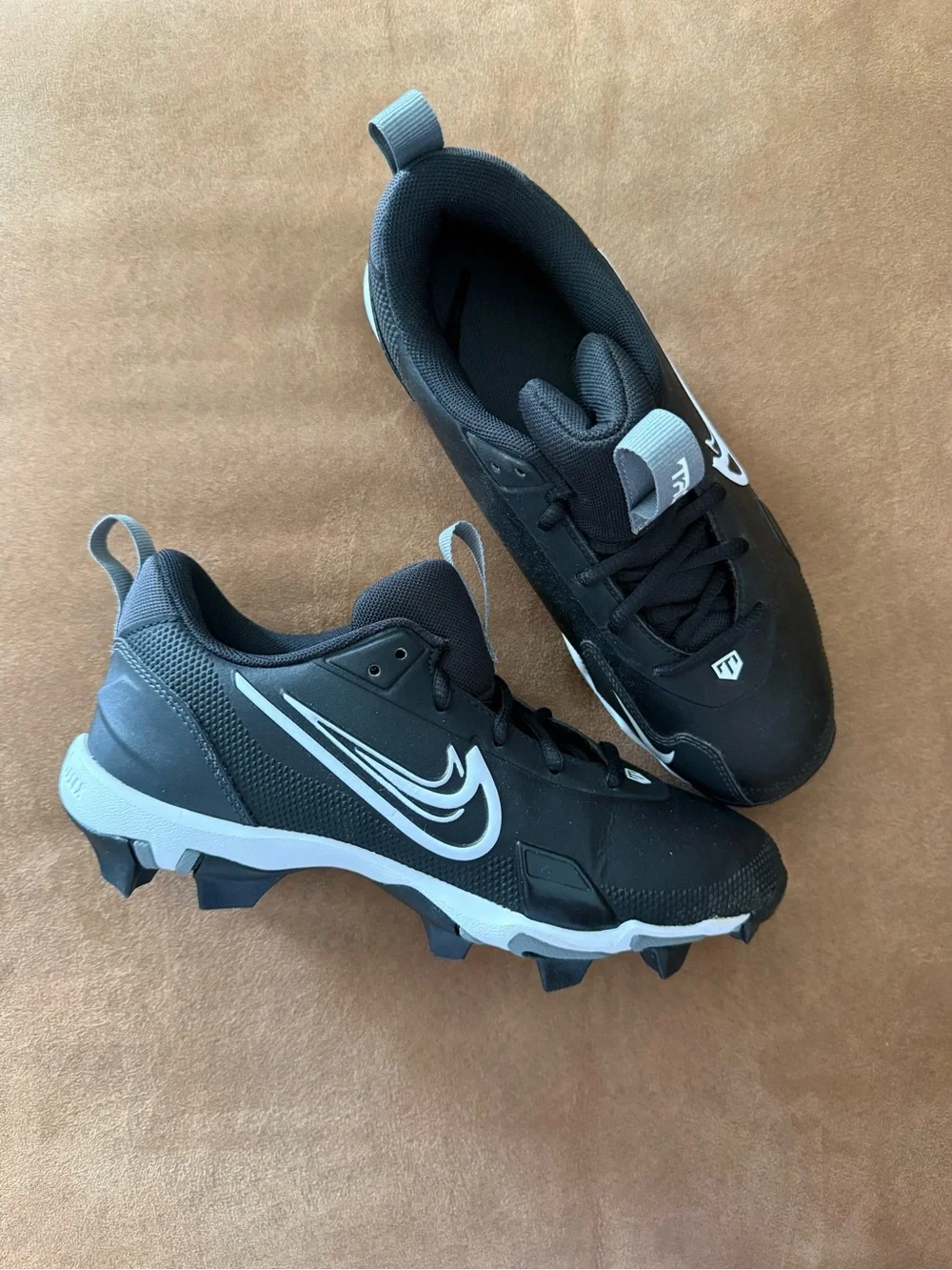 Nike Kids Black and White Cleats with Swoosh Detail